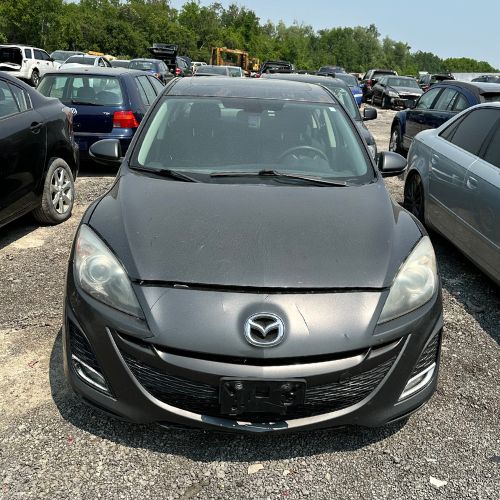 Black Mazda 3 hatchback selected for scrap car removal in Toronto.