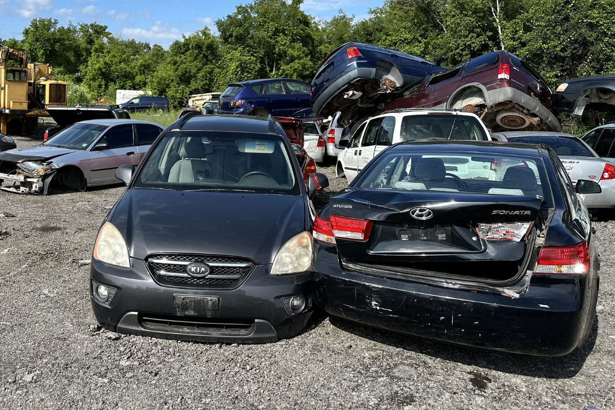 Scrap car and a junk car paked in a scrapyard