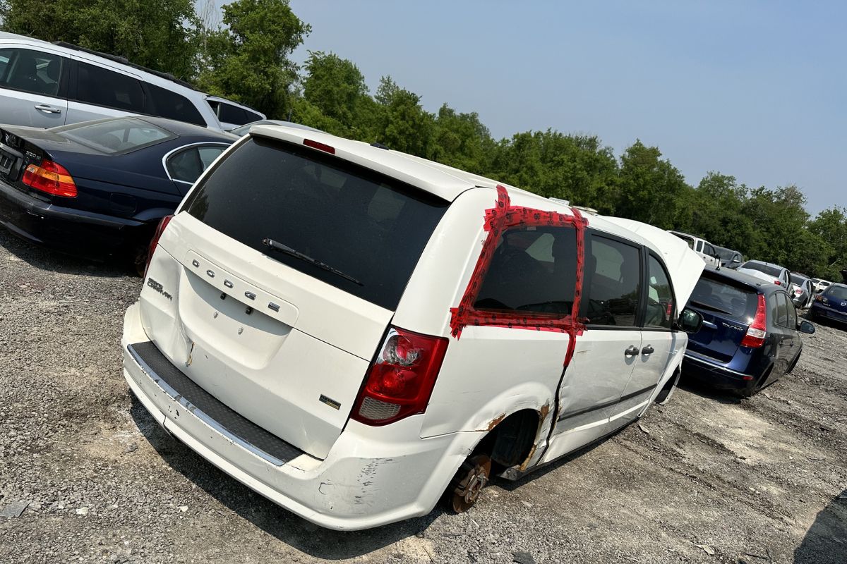 scrap your car and transfer your insurance Scrap your car - a white car parked in a scrapyard